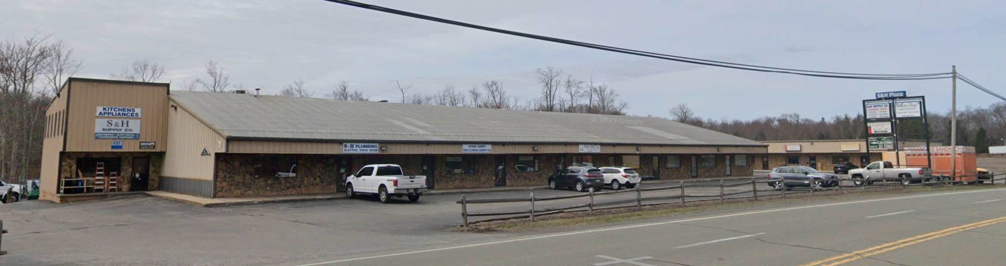S&H Supply Co. full building exterior view from PA-435 road showing complete facility and surrounding area