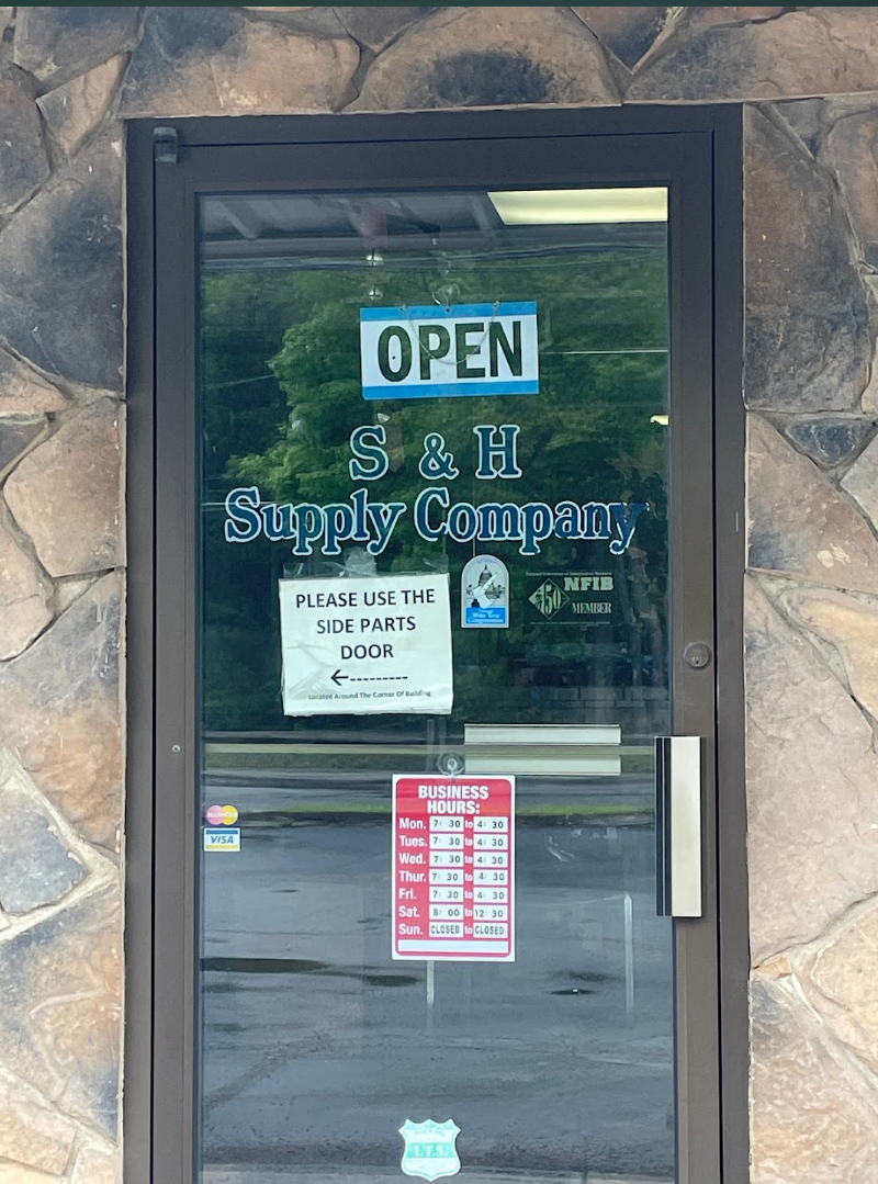 S&H Supply Co. storefront entrance with business hours and open sign in Gouldsboro PA